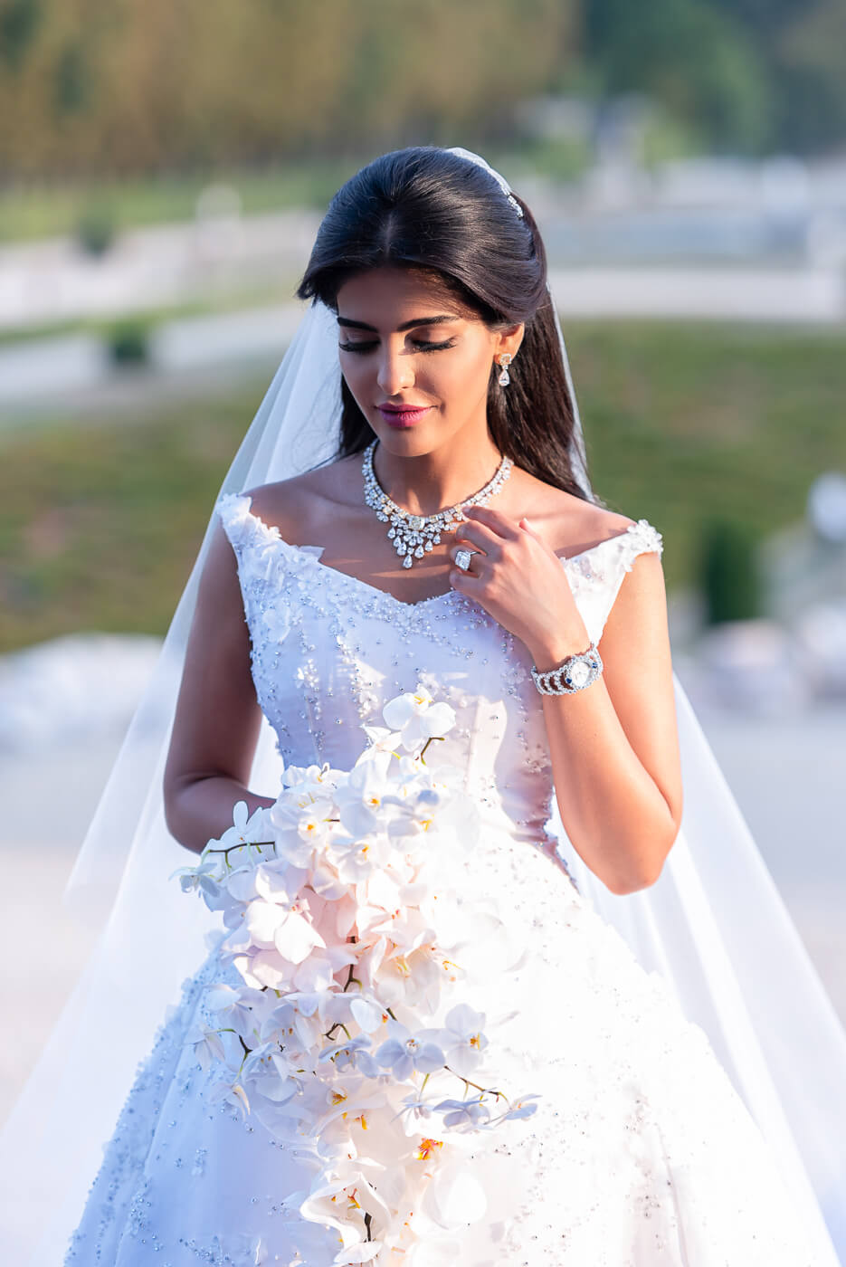 Princess bride in Dior wedding dress at luxury French chateau Vaux-le-Vicomte near Paris France