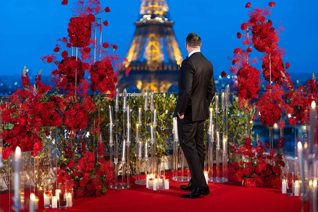 Paris proposal photographer captures luxury Eiffel Tower proposal at La Shangri-La penthouse during blue hour with candlelit floral arrangements